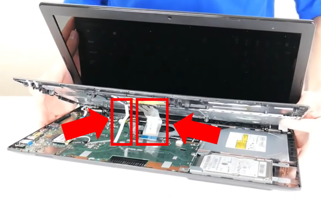 Ribbon cables connecting the palmrest of a Toshiba laptop to the motherboard.