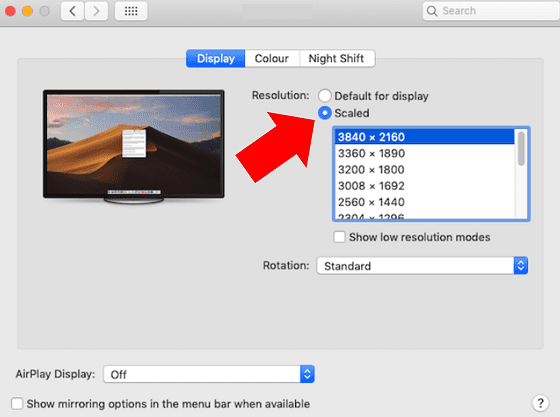 Adjust resolution settings on MacBook.